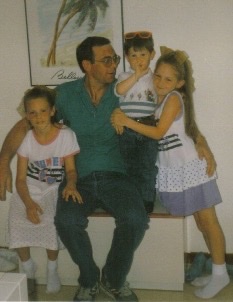 Sam Decombel's father with his children